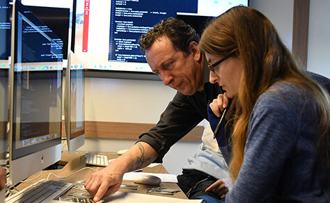 An image of two people conversing